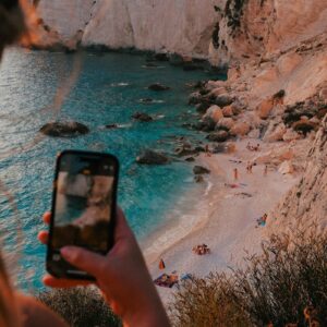 Someone is taking a picture of a beautiful beach.
