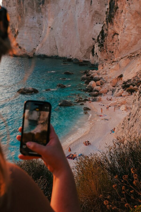 Someone is taking a picture of a beautiful beach.